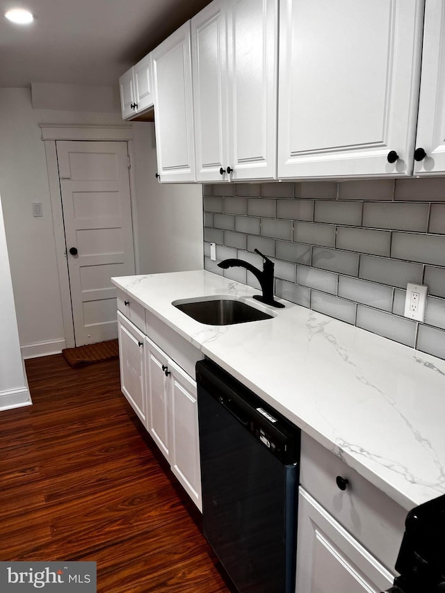 kitchen featuring white cabinetry, dishwasher, sink, dark hardwood / wood-style flooring, and light stone counters