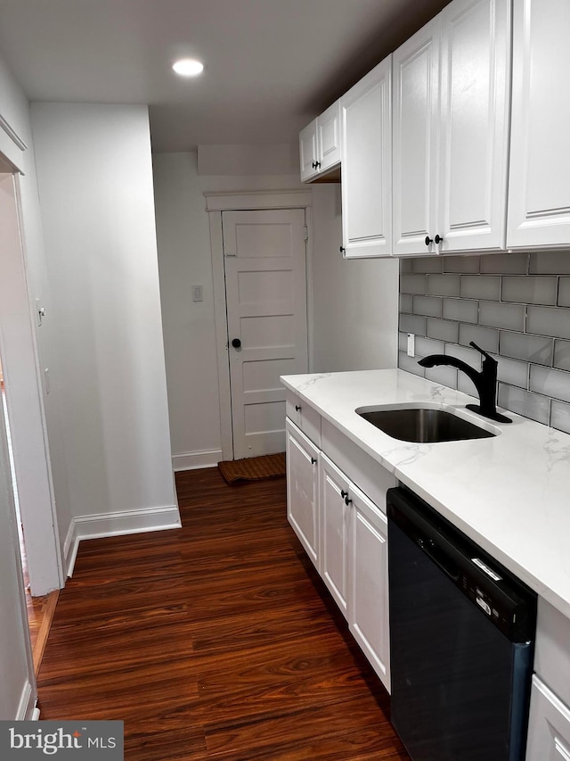 kitchen with dark wood-type flooring, sink, dishwasher, decorative backsplash, and white cabinets