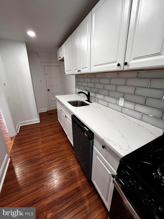 kitchen with light stone counters, sink, black appliances, and white cabinets