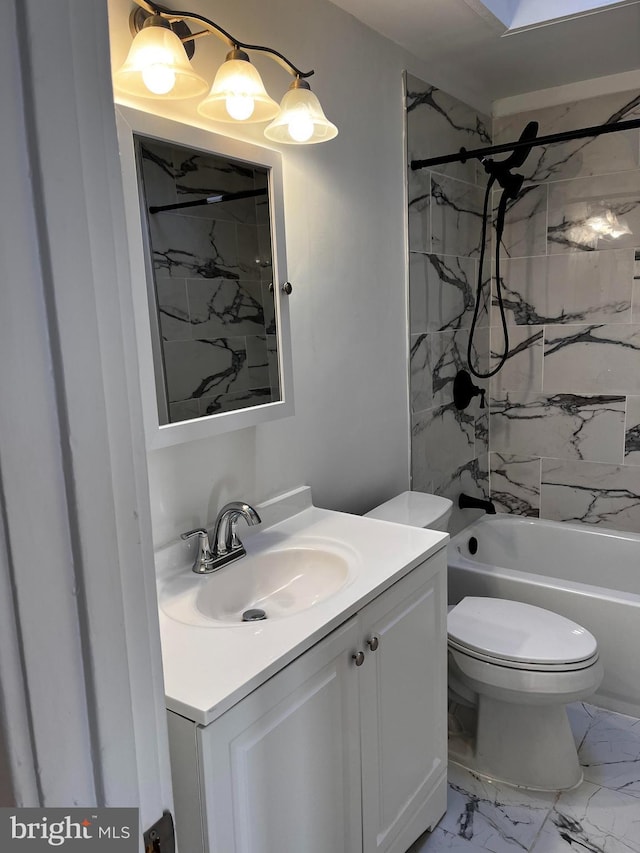 full bathroom with tiled shower / bath combo, vanity, and toilet