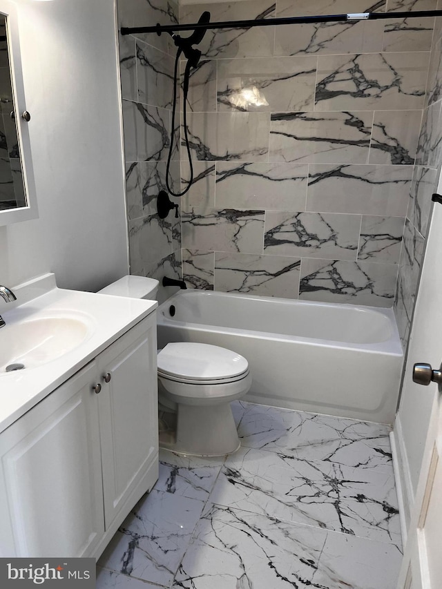 full bathroom featuring vanity, toilet, and tiled shower / bath