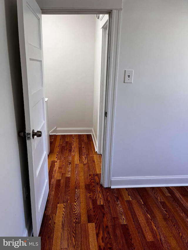 hall with dark hardwood / wood-style floors