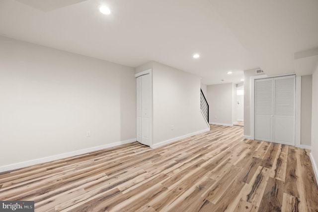 basement featuring light hardwood / wood-style floors