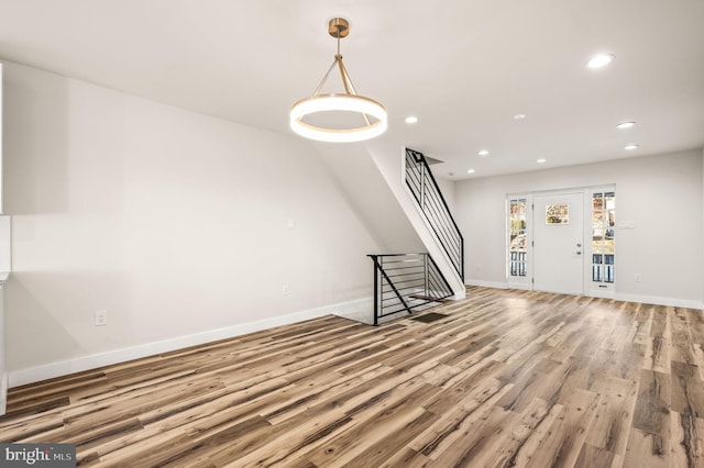 unfurnished living room with hardwood / wood-style flooring