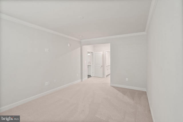 carpeted empty room with crown molding