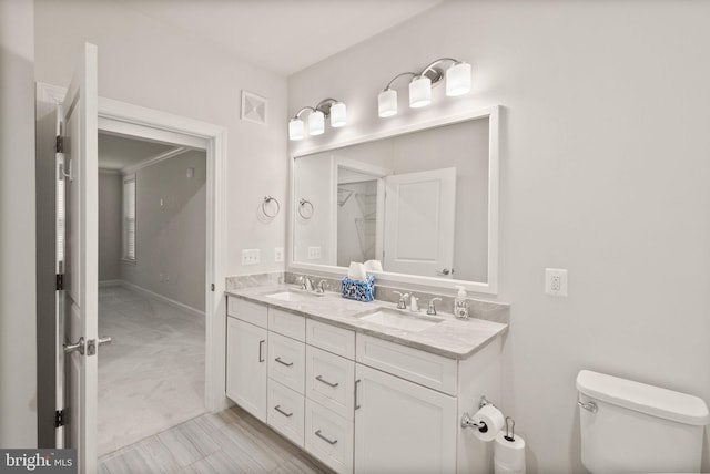 bathroom with vanity and toilet