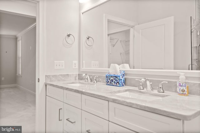 bathroom with vanity and ornamental molding