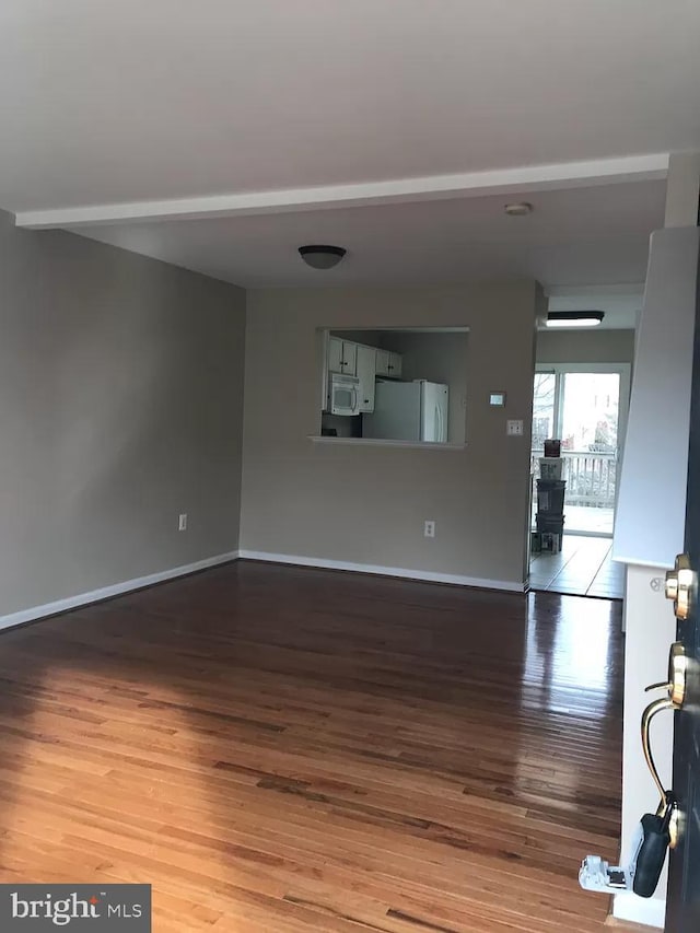 unfurnished room featuring hardwood / wood-style flooring