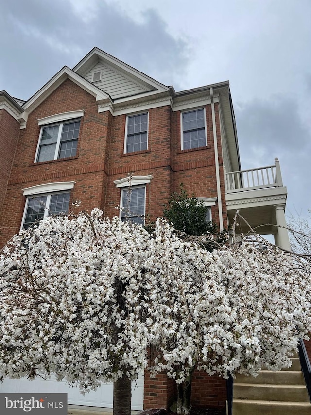 view of home's exterior featuring a balcony