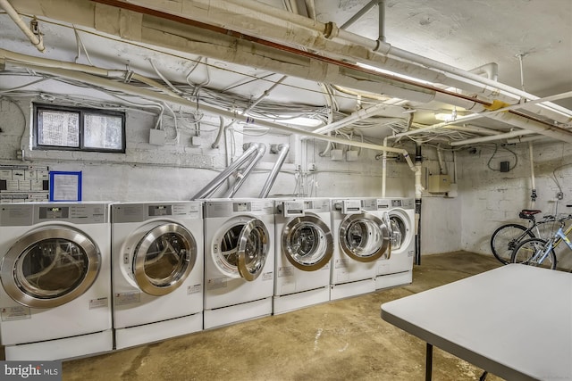 clothes washing area with washer and dryer