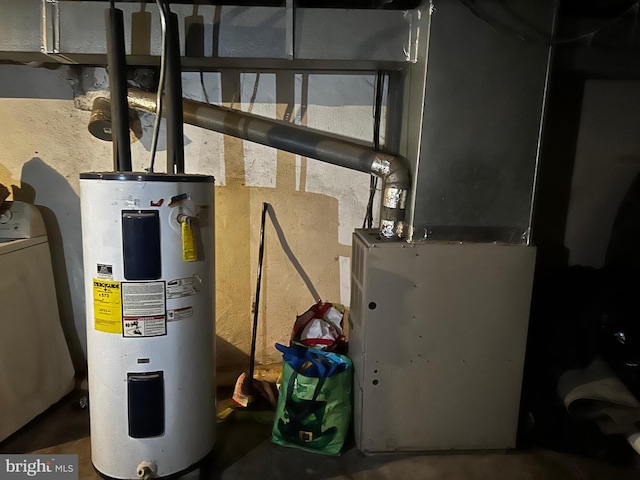 utility room with washer / clothes dryer and water heater