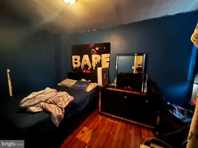 bedroom featuring hardwood / wood-style flooring