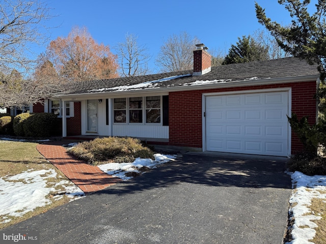 ranch-style house featuring a garage