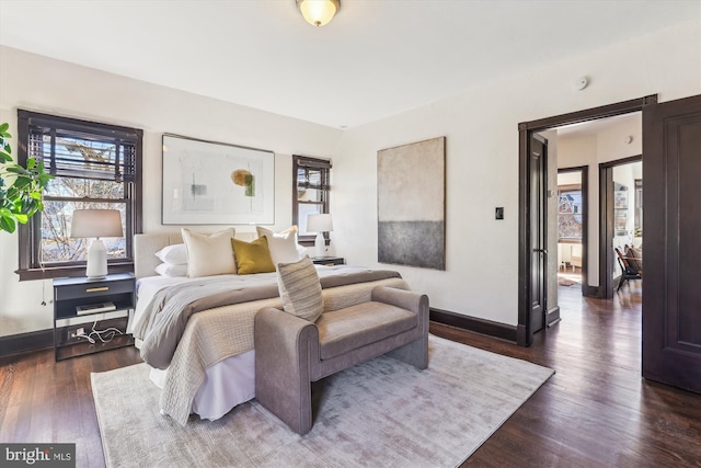 bedroom with dark wood-type flooring