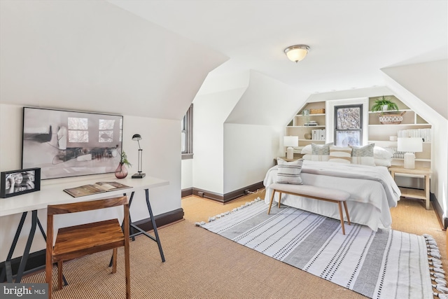 carpeted bedroom with vaulted ceiling