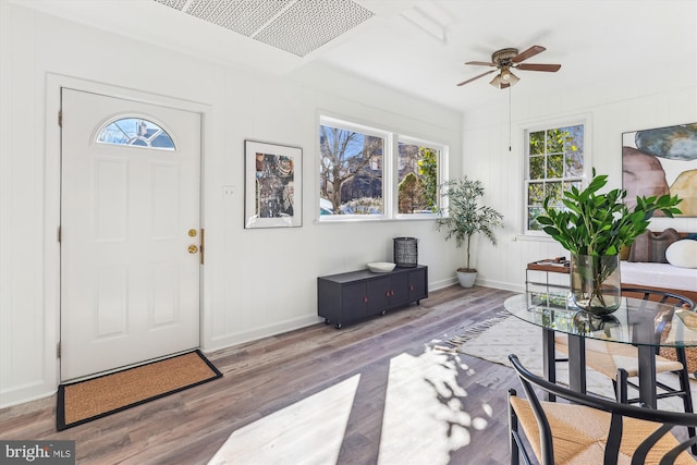 foyer entrance with wood-type flooring and ceiling fan