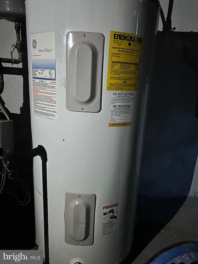 utility room featuring water heater