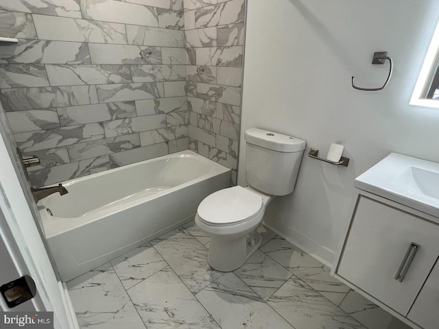 full bathroom featuring tiled shower / bath, vanity, and toilet