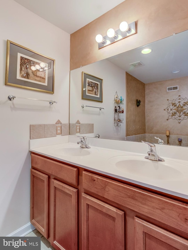 bathroom featuring vanity and tile patterned flooring