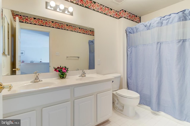 bathroom with vanity, tile patterned floors, toilet, and a shower with shower curtain