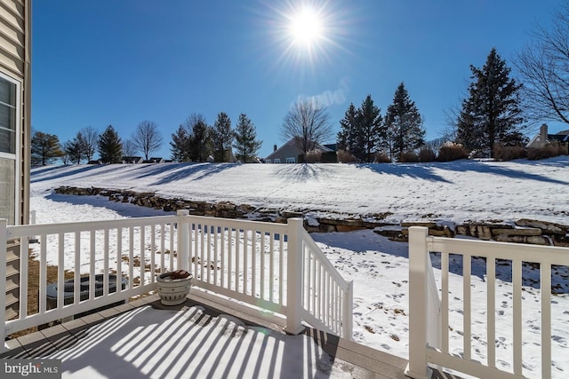 view of snow covered deck