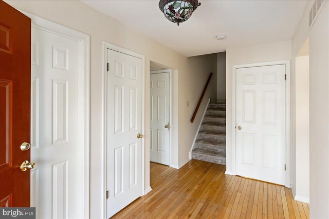 hall with light hardwood / wood-style floors