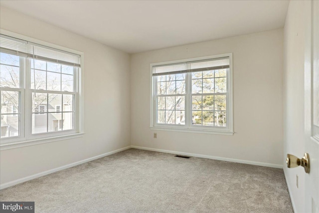 spare room with light colored carpet