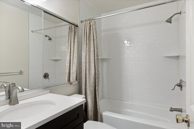 full bathroom with vanity, shower / bath combination with curtain, and toilet