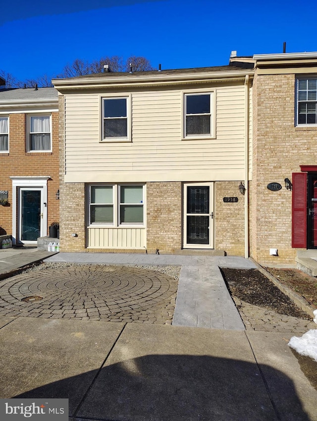 back of property with brick siding