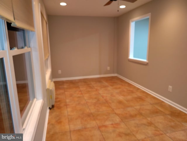 spare room with light tile patterned floors, recessed lighting, baseboards, and ceiling fan