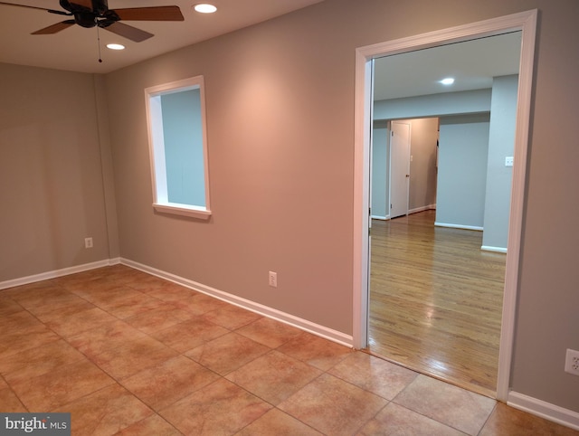 empty room featuring recessed lighting, baseboards, light tile patterned flooring, and a ceiling fan