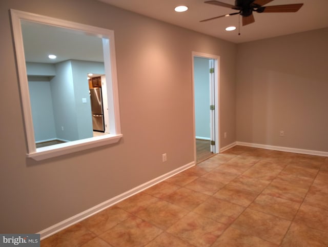 spare room with recessed lighting, baseboards, and a ceiling fan