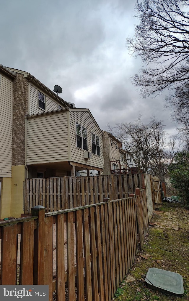 back of property featuring fence