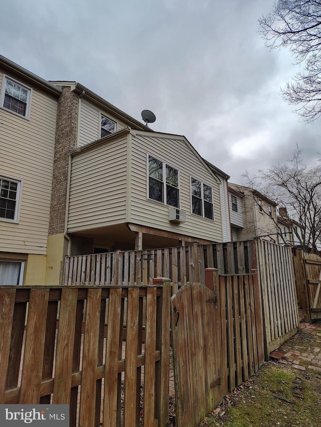 back of property with fence