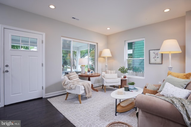 living room with dark wood-style flooring, baseboards, and recessed lighting