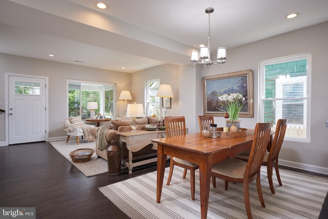 dining room featuring wood finished floors, a chandelier, recessed lighting, and baseboards