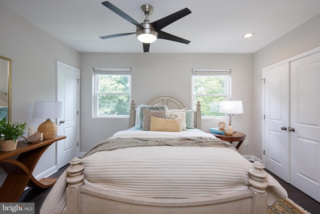 bedroom with wood finished floors, baseboards, a closet, a ceiling fan, and recessed lighting