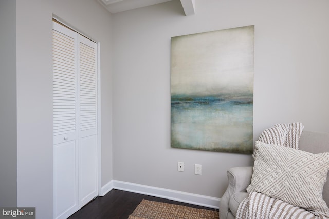 sitting room featuring dark wood finished floors and baseboards