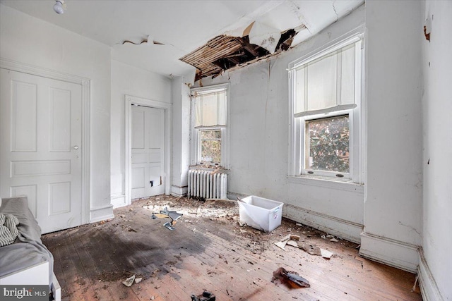 unfurnished bedroom featuring radiator heating unit