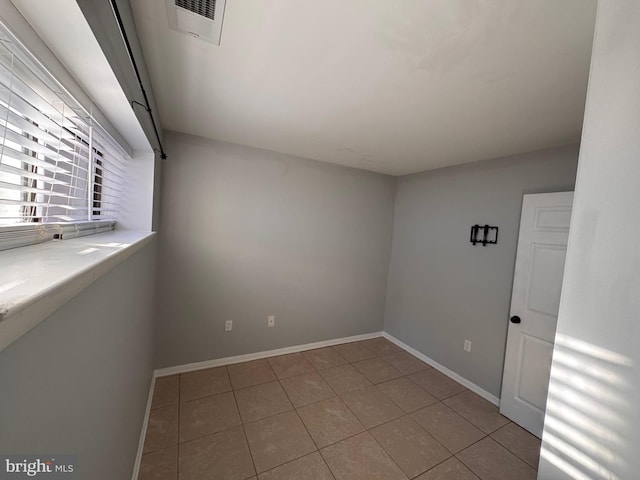 view of tiled spare room