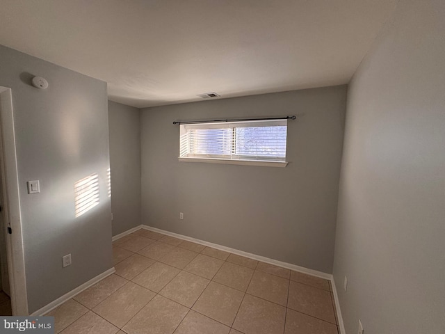 view of tiled spare room