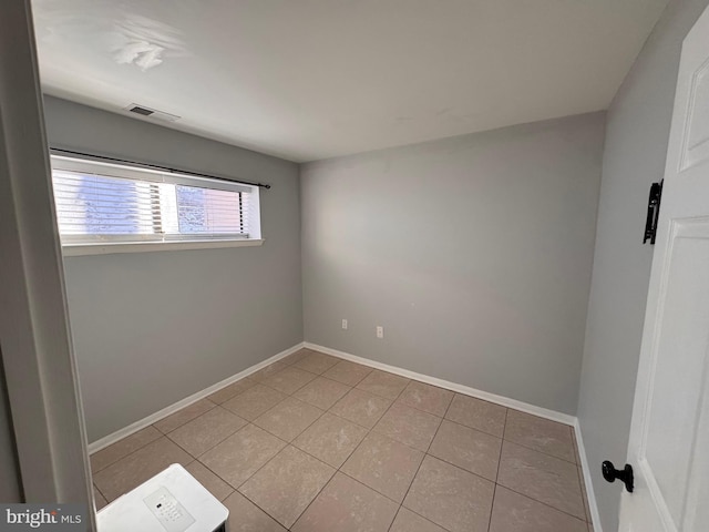 view of tiled spare room