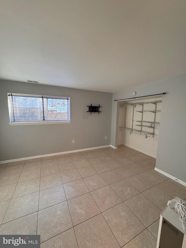 empty room featuring tile patterned flooring