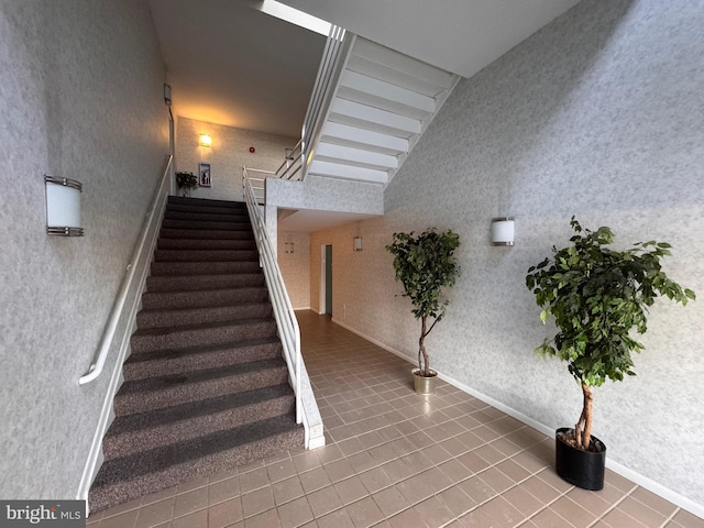 staircase with tile patterned flooring