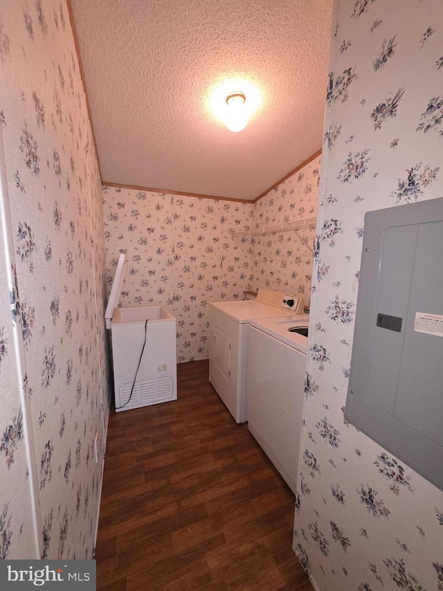 laundry area featuring washing machine and clothes dryer, a textured ceiling, laundry area, electric panel, and wallpapered walls