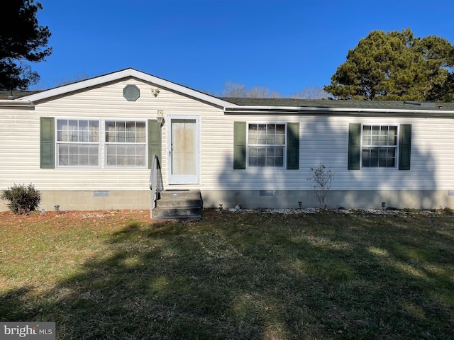 view of front of home featuring a front yard, crawl space, and entry steps