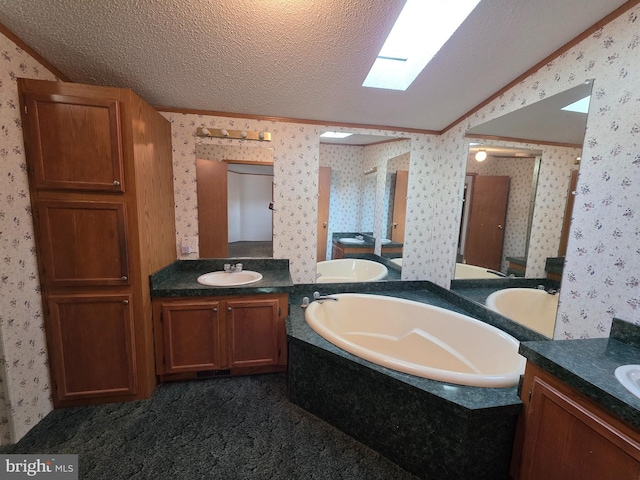 full bathroom with wallpapered walls, a textured ceiling, two vanities, and a sink