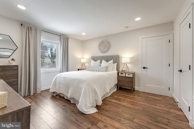 bedroom with hardwood / wood-style flooring