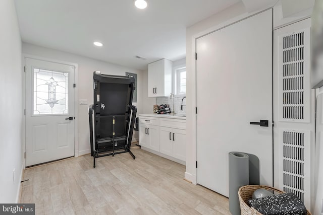 interior space featuring light hardwood / wood-style flooring and plenty of natural light