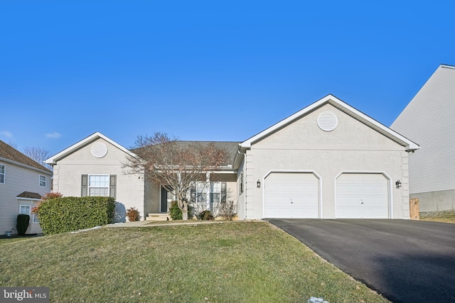 ranch-style home featuring a garage and a front lawn